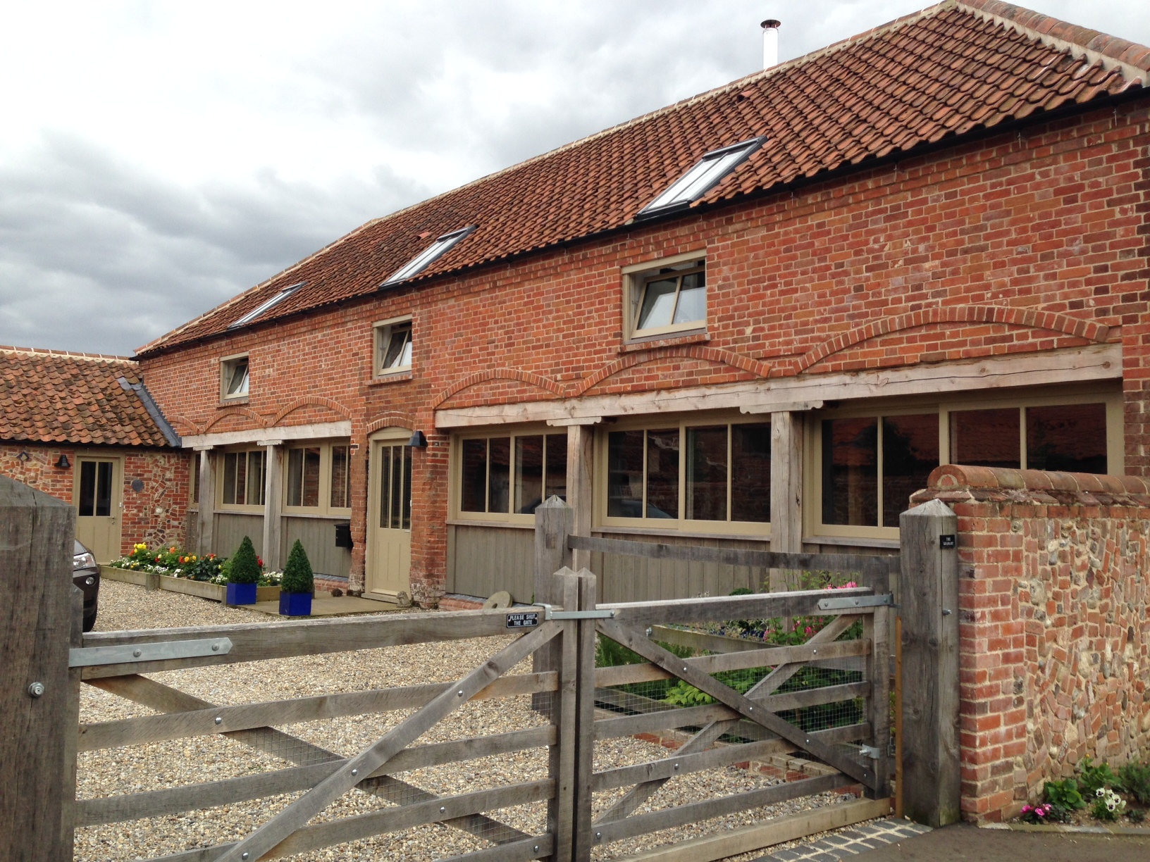 Courtyard view with recessed glazed panels and expressed timber posts