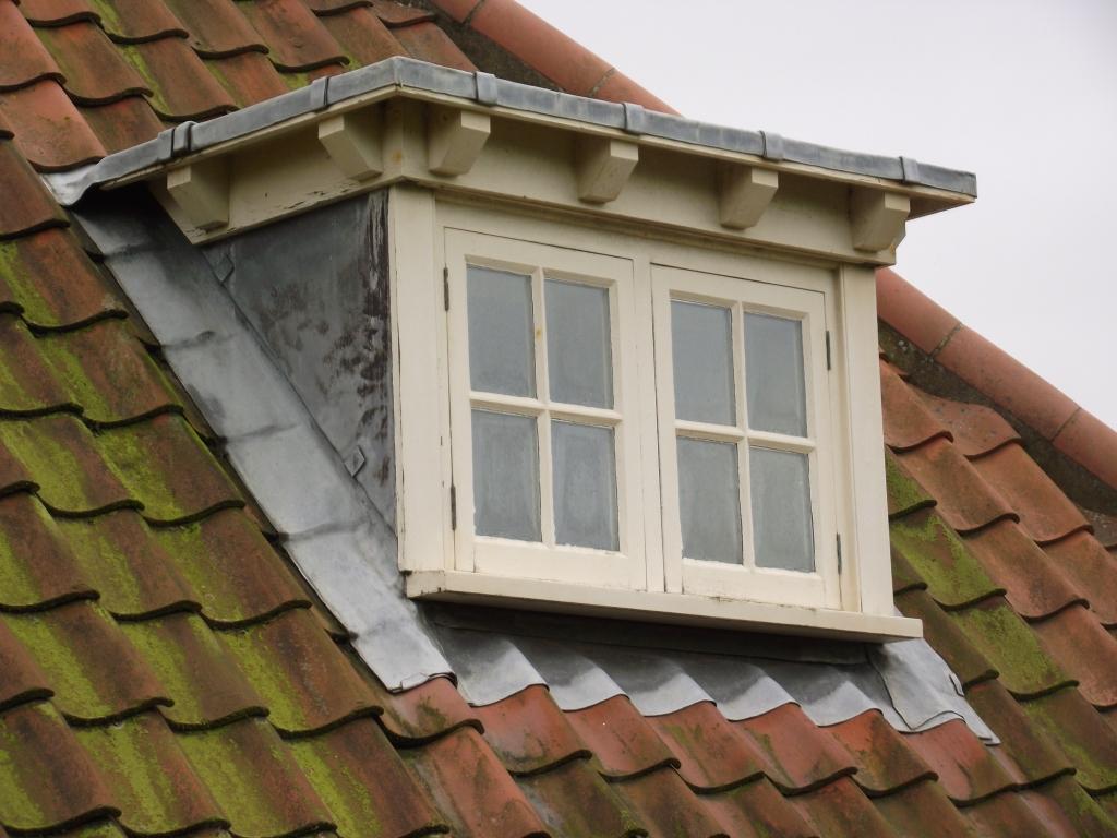 Flat roof dormer with lead cheeks and flashing.